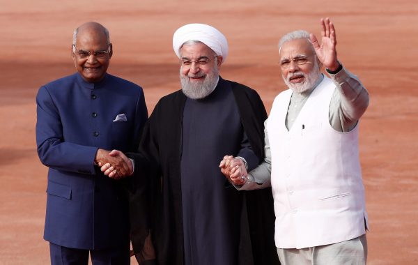 Iranian President Hassan Rouhani holds hands with Indian President Ramnath Kovind and Indian Prime Minister Narendra Modi at Rouhani's ceremonial reception in New Delhi, India, 17 February 2018 (Photo: Reuters/Adnan Abidi).