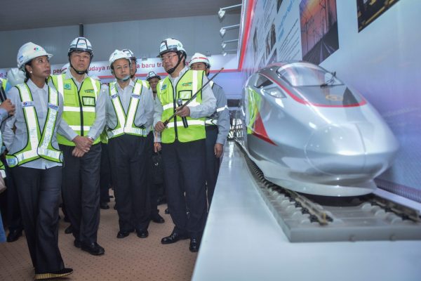 State-owned enterprises Minister Rini Soemarno (L), along with China Railway Corporation general manager Lu Dongfu (2nd L), receive a briefing on the progress of the Jakarta-Bandung Fast Train project, backed by China's Belt and Road Initiative, in Jakarta, Indonesia, 2 May 2018 (Photo: Reuters/Antara Foto/Aprillio Akbar).