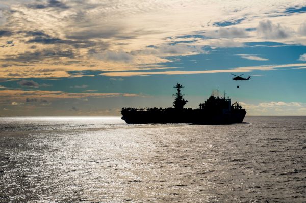 The Nimitz-class aircraft carrier USS John C Stennis conducts a replenishment-at-sea with the dry cargo and ammunition ship USNS Charles Drew, 13 November 2018 (Photo: Nick Bauer/US Navy via Reuters).