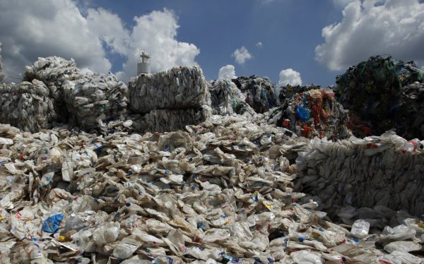Discarded plastic bottles imported from Australia are seen at a plant in Hong Kong's rural New Territories on 24 August 2011, before a process which separates plastic waste from them (Photo: Reuters/Bobby Yip).