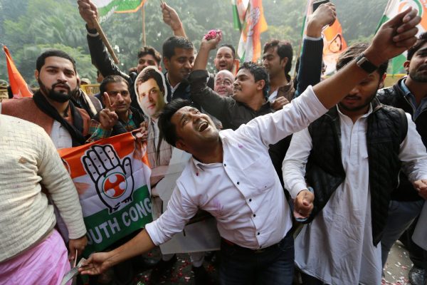 Supporters of India’s main opposition Congress party celebrate after the initial poll results at the party headquarters in New Delhi, India, 11 December 2018. (Photo: Reuters/Adnan Abidi).