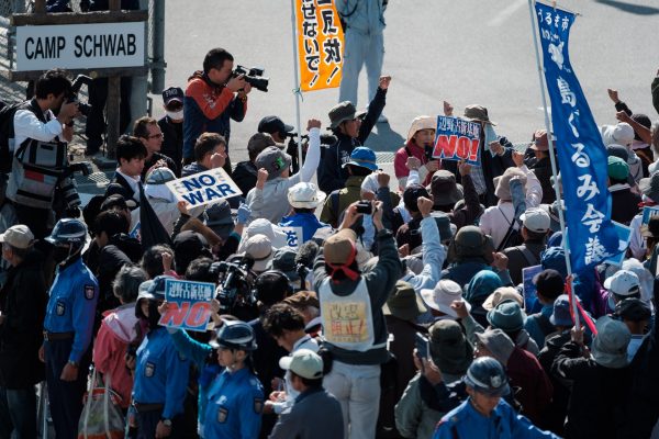 Protesters against base construction gather in the early morning to protest landfill operation. On 14 December 2018 the landfill work restart at Henoko coastal in Nago, Okinawa, for the building of a new facility at Camp Schawb to take over the functions of the US Marine Corps' Futenma Air Station, now in Ginowan, another city in Okinawa (Photo: Reuters/Nicolas Datiche/AFLO).