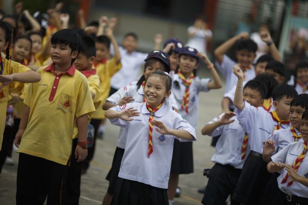 Students exercise at a school in Bangkok, Thailand. (Photo: Reuters/Athit Perawongmetha).