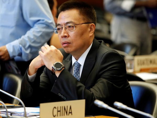 Xiangchen Zhang Chinese Ambassador to the WTO looks on before the start of the General Council meeting at the World Trade Organization (WTO) in Geneva, Switzerland, 26 July 2018 (Photo: Reuters/Denis Balibouse).