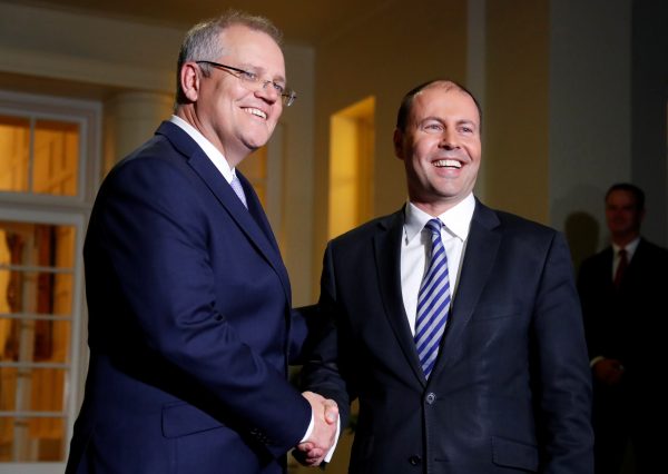 The new Australian Prime Minister Scott Morrison shakes hands with the new Treasurer Josh Frydenberg after the swearing-in ceremony in Canberra, Australia, 24 August 2018 (Photo: Reuters/David Gray).