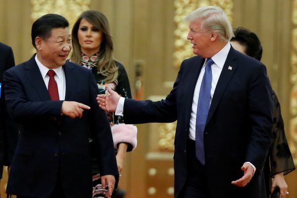 US President Donald Trump and China's President Xi Jinping arrive at a state dinner at the Great Hall of the People in Beijing, China, 9 November 2017 (Photo: Reuters/Thomas Peter).