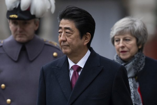Britain's Prime Minister Theresa May walks with Japanese Prime Minister Shinzo Abe as he receives a military Guard of Honour at the Foreign and Commonwealth Office ahead of bilateral talks in London, Britain, 10 January 2019 (Photo: Reuters/Dan Kitwood).