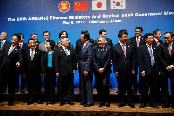 Ministers and central bank governors pose during a photo session at ASEAN+3 Finance Ministers and Central Bank Governors' Meeting on the sideline of Asian Development Bank (ADB)'s annual meeting in Yokohama, Japan on 5 May 2017 (Photo: Reuters/Issei Kato).