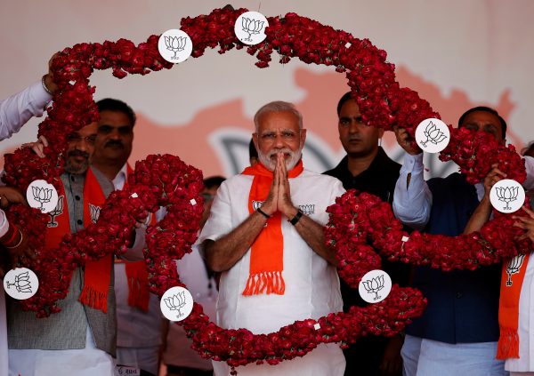 India's Prime Minister Narendra Modi is garlanded by supporters during a public rally at Bhaat village on the outskirts of Ahmedabad, India, 16 October 2017 (Photo: Reuters/Amit Dave).