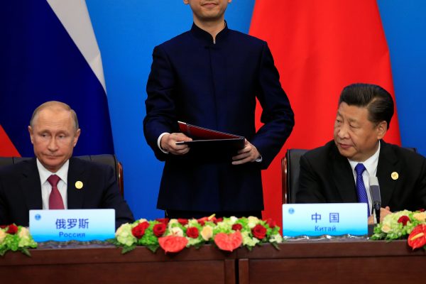 China's President Xi Jinping and Russia's President Vladimir Putin attend a signing ceremony during the Shanghai Cooperation Organization summit in Qingdao, Shandong Province, China, 10 June 2018 (Photo: Reuters/Aly Song).
