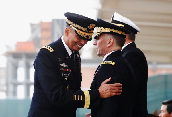 Outgoing Commander, General Vincent K Brooks walks past Incoming Commander, General Robert B. Abrams after delivering his speech during a change of command ceremony for the United Nations Command, Combined Forces Command, and United States Forces Korea at the U.S. military base in Pyeongtaek, South Korea, 8 November 2018 (Photo: Reuters/Kim Hong-Ji).