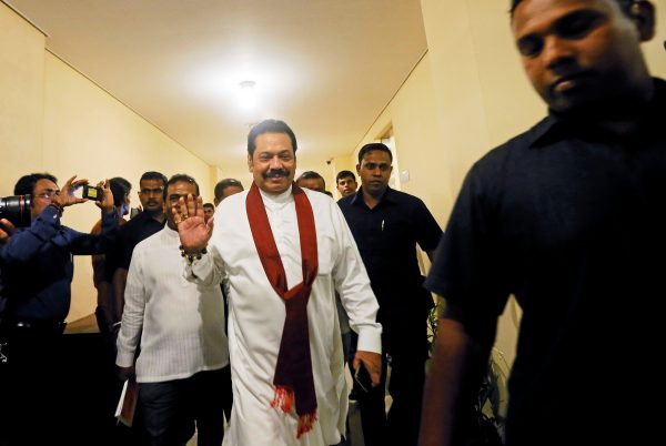Mahinda Rajapaksa waved as he arrived at the parliament in Colombo, Sri Lanka on 29 November 2018 after he was newly appointed as Prime Minister (Photo: Reuters/Dinuka Liyanawatte).