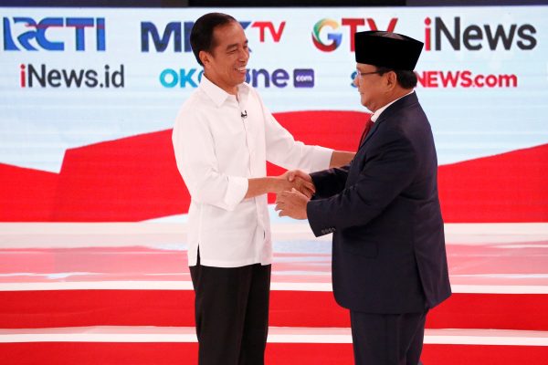 Indonesia's presidential candidate Joko Widodo (L) shakes hands with his opponent Prabowo Subianto after the second debate between presidential candidates ahead of the next general election in Jakarta, Indonesia, 17 February 2019 (Photo: Reuters/Willy Kurniawan).