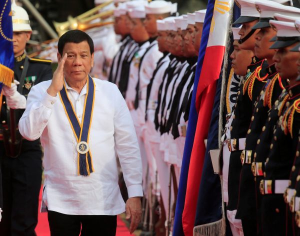 Philippine President Rodrigo Duterte salutes while passing honour guards upon arrival during the 120th Philippine Navy anniversary in Metro Manila, Philippines, 22 May 2018 (Photo: Reuters/Romeo Ranoco).
