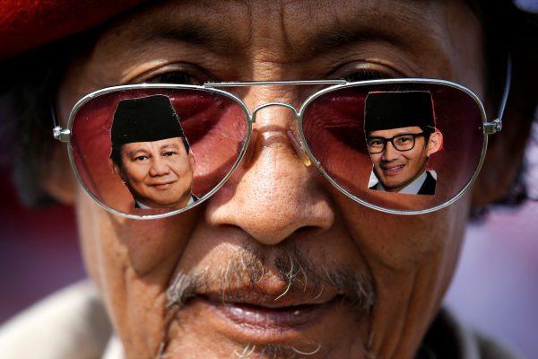 A supporter wears glasses as he attends a campaign rally of Indonesia's presidential candidate Prabowo Subianto for the upcoming general election, in Bandung, West Java province, Indonesia, 28 March 2019 (Photo: Reuters/Willy Kurniawan).
