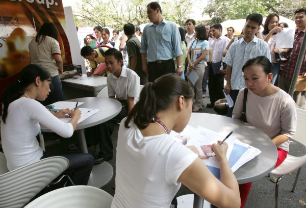 Filipinos being interviewed at a jobs fair for outsourced work in Manila. Women-friendly initiatives can improve female employees’ commitment to the firm (Photo: Romen Ranoco/Reuters).