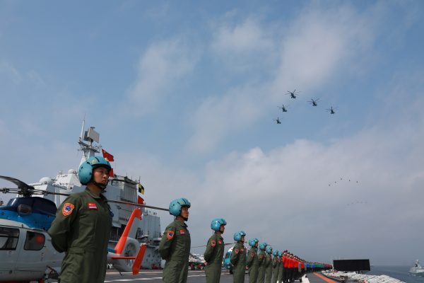 Navy personnel of Chinese People's Liberation Army (PLA) Navy take part in a military display in the South China Sea 12 April 2018 (Photo: Reuters/Stringer).