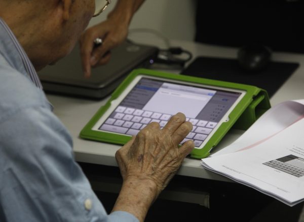 Dereck Wangwiwatana, 84, participates in a basic learning course for the iPad at the Old People Playing Young (OPPY) IT school in Bangkok, 29 March 2012 (Photo: Reuters/Chaiwat Subprasom).