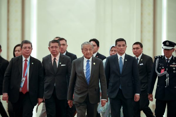 Malaysian Prime Minister Mahathir Mohamad walks towards Chinese President Xi Jinping before a bilateral meeting of the Second Belt and Road Forum at the Great Hall of the People in Beijing, China, 25 April 2019 (Photo: Reuters/Andrea Verdelli).