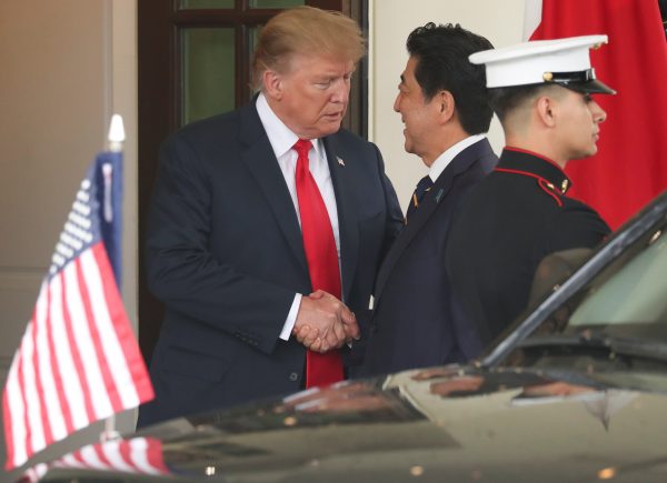US President Donald Trump shakes hands with Japan's Prime Minister Shinzo Abe as he welcomes him at the White House in Washington, 26 April 2019 (Photo: Reuters/Jonathan Ernst).