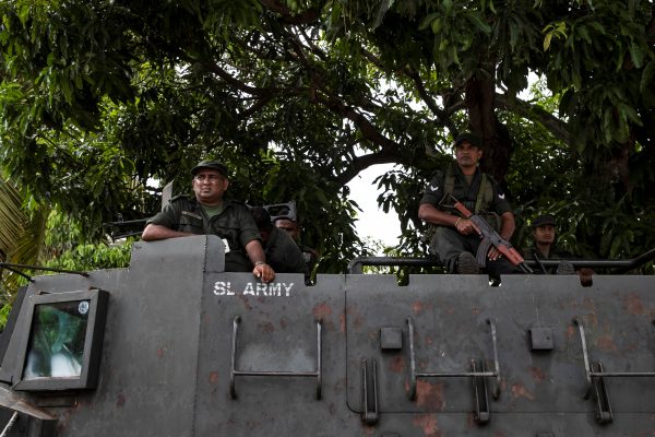 Soldiers stand guard on an armoured vehicle outside St. Sebastian Church, days after a string of suicide bomb attacks across the island on Easter Sunday, in Negombo, Sri Lanka, 1 May 2019. (Photo: Reuters/Danish Siddiqui).
