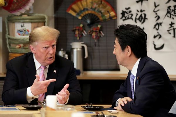 US President Donald Trump talks with Japanese Prime Minister Shinzo Abe in Tokyo, 26 May 2019 (Photo: Kiyoshi Ota/Pool via Reuters).