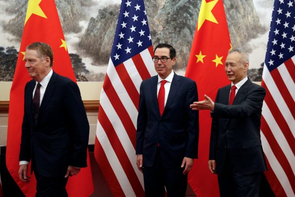 Chinese Vice Premier Liu He, right, shows the way to US Treasury Secretary Steven Mnuchin, center, and US Trade Representative Robert Lighthizer, left, 1 May 2019. (Photo: Andy Wong/Pool via Reuters).