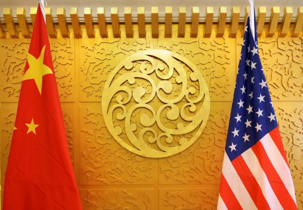Chinese and US flags are set up for a meeting in Beijing, China, 27 April 2018 (Photo: REUTERS/Jason Lee)