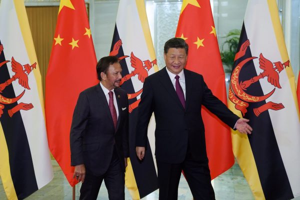 Chinese President Xi Jinping shows the way to the meeting room to Brunei's Sultan Hassanal Bolkiah before the bilateral meeting of the Second Belt and Road Forum at the Great Hall of the People on 26 April 2019 in Beijing, China. (Photo: Andrea Verdelli/Pool via Reuters).