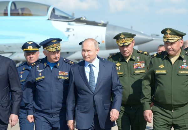 Russian President Vladimir Putin, accompanied by Defence Minister Sergei Shoigu and Chief of the General Staff of Russian Armed Forces Valery Gerasimov, tours an exhibition of military transport and equipment as he visits a Defence Ministry’s flight test centre in the town of Akhtubinsk in Astrakhan Region, Russia, 14 May 2019 (Photo: Reuters/Sputnik/Alexei Nikolsky).