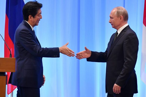 Russia's President Vladimir Putin shakes hands with Japan's Prime Minister Shinzo Abe during a news conference after the G20 Summit in Osaka, Japan, 29 June 2019 (Photo: Reuters/Yuri Kadobnov).