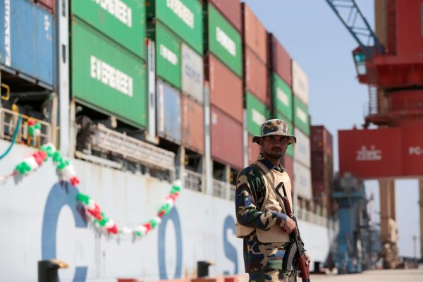 A soldier stands guard beside the Cosco Wellington, the first container ship to depart after the inauguration of the China Pakistan Economic Corridor port in Gwadar, Pakistan November 13, 2016. (Photo: Reuters/Caren Firouz)