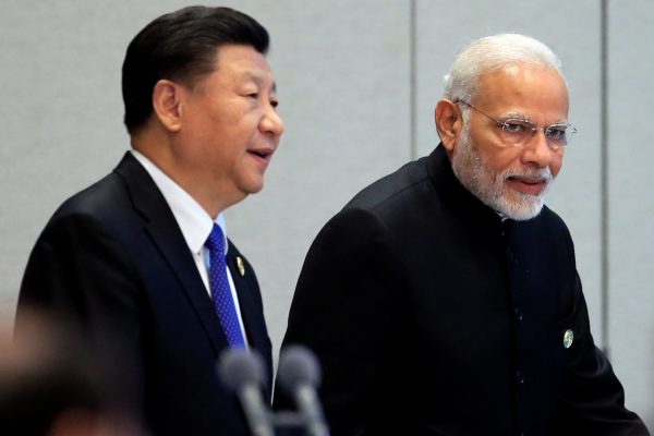 hina's President Xi Jinping and India's Prime Minister Narendra Modi arrive for a signing ceremony during Shanghai Cooperation Organization (SCO) summit in Qingdao, Shandong Province, China, 10 June 2018. (Photo: Reuters/Aly Song)
