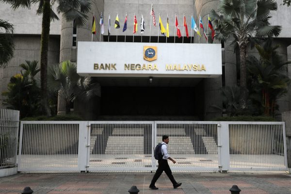A man walks past the entrance of Central Bank of Malaysia (Bank Negara Malaysia) in Kuala Lumpur, Malaysia, 31 July 2019 (Photo: Reuters/Lim Huey Teng).