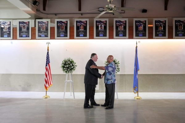 U.S. Secretary of State Mike Pompeo shakes hands with Federated States of Micronesia President David Panuelo after they placed wreaths at a memorial to fallen Micronesians who served in the U.S. military, at Pohnpei International Airport in Kolonia, Federated States of Micronesia 5 August 2019 (Photo: Reuters/Jonathan Ernst).