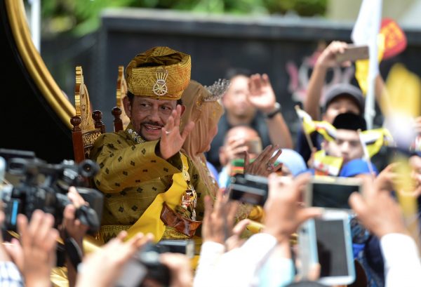 Brunei's Sultan Hassanal Bolkiah waves to people as he passes in a procession to mark his golden jubilee of his accession to the throne in Bandar Seri Begawan 5 October, 2017 (Photo: Reuters/Rani).