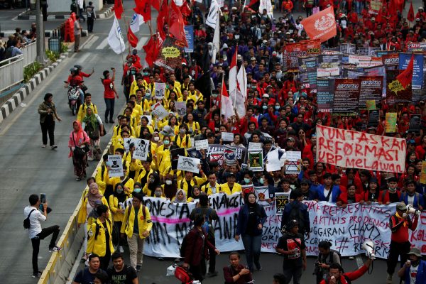 University students and members of Indonesian labour organisations take part in a protest over human rights, corruption and social and environmental issues. Jakarta, Indonesia, 28 October 2019 (Photo: Reuters/Willy Kurniawan).