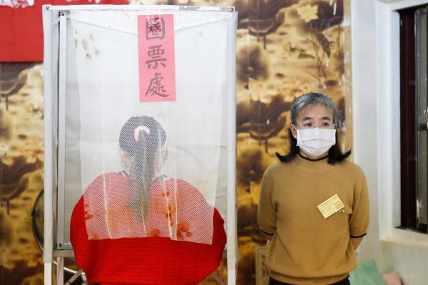 A Taiwanese voter stands at a polling booth during the general elections in Kaohsiung, Taiwan, 11 January 2020 (Photo: Reuters/Ann Wang).