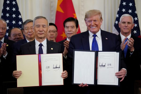 US President Donald Trump stands Chinese Vice Premier Liu He after signing 'phase one' of the US-China trade agreement in the East Room of the White House in Washington, US, 15 January 2020 (Photo: Reuters/Kevin Lamarque).