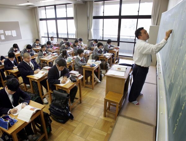 A Japanese school teacher teaching a class at a junior high school in Tochigi, north of Tokyo, 14 April 2005 (Photo: Reuters/Yuriko Nakao).