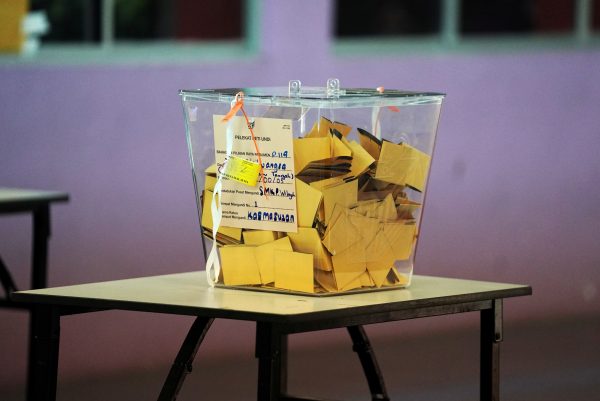 A ballot box sits on a table at a polling station during an election in Malaysia (Photo: Reuters/Athit Perawongmetha).