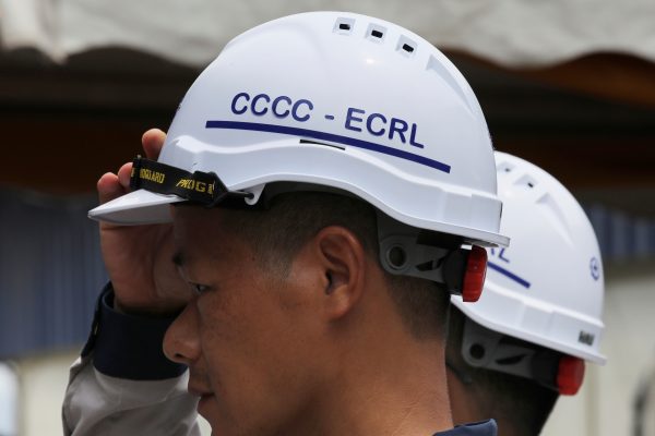A worker adjusts his safety helmet at the tunnel constructions site of the East Coast Rail Link (ECRL) project in Dungun, Terengganu, Malaysia, 25 July 2019 (Photo:Reuters/Lim Huey Teng).