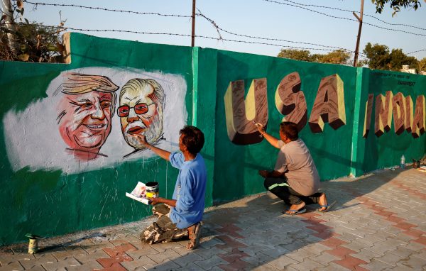 Painting US President Donald Trump and Indian Prime Minister Narendra Modi on a wall along the route that Trump and Modi will take during Trump's upcoming visit, Ahmedabad, India, 17 February 2020 (Photo: Reuters/Amit Dave).