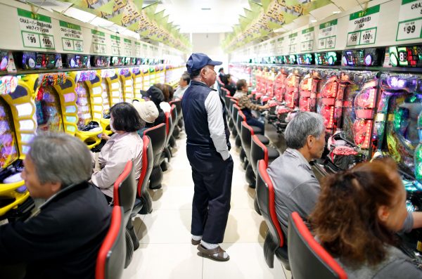 Visitors play pachinko, a Japanese form of legal gambling, at a pachinko parlour in Fukushima, Japan, 24 May 2018 (Photo: Reuters/Issei Kato).