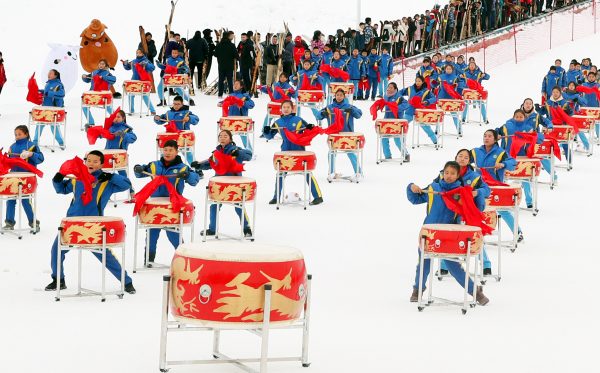 Local students drum dance at the opening ceremony of the 14th Xinjiang Winter Tourism Trade Fair and the skiing carnival at a skiing field on Jiangjun Mountain in Altay, northwest China's Xinjiang Uyghur Autonomous Region, 27 November 2019 (Photo: Reuters/Imagine China/Zhang Xiuke).