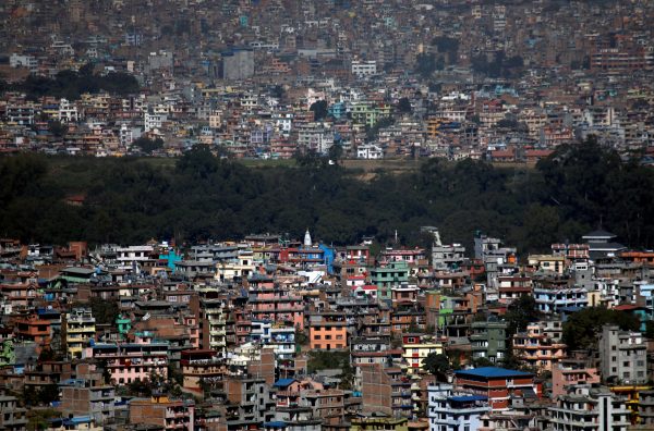 A tree line is pictured between the densely built houses and buildings of Kathmandu Nepal 14 November, 2019 (Photo: Reuters/Chitrakar).
