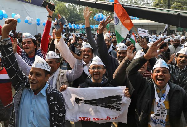 Supporters of Aam Aadmi Party (AAP) celebrate after learning of the initial poll results outside its party headquarters in New Delhi, India, 11 February 2020 (Reuters/Anushree Fadnavis).