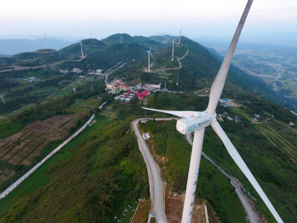 Wind turbines whirl to generate electricity at a wind farm in Lichuan city, Enshi Tujia and Miao Autonomous Prefecture, central China's Hubei province, 11 September 2016.