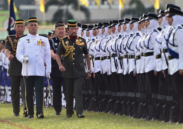 Brunei's Sultan Hassanal Bolkiah inspects an honour guard during the 34th National Day celebrations in Bandar Seri Begawan, 24 February 2018 (Reuters/Ahim Rani).