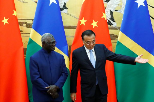 Solomon Islands Prime Minister Manasseh Sogavare and Chinese Premier Li Keqiang attend a signing ceremony at the Great Hall of the People in Beijing, China, 9 October 2019 (Photo:Reuters/Thomas Peter).
